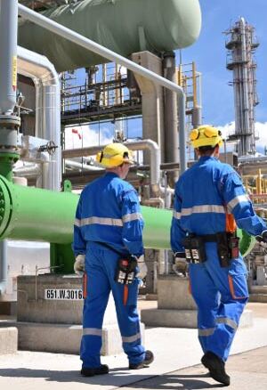 Group-of-workmen-in-a-petroleum-refinery-managing-industrial-wastewater